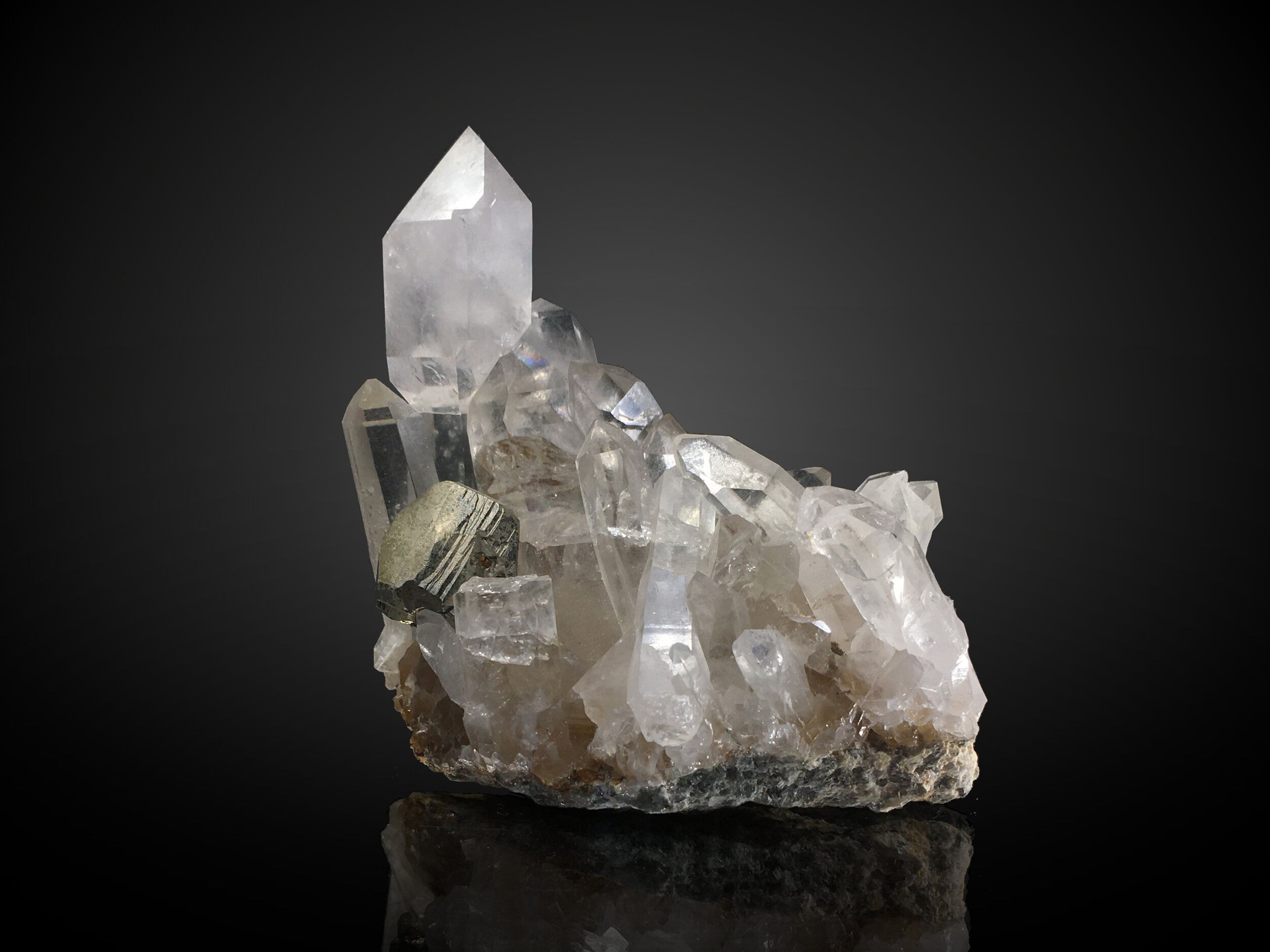 A cluster of prominent quartz scepters with a nice sharp pyrite from Spruce Ridge.
