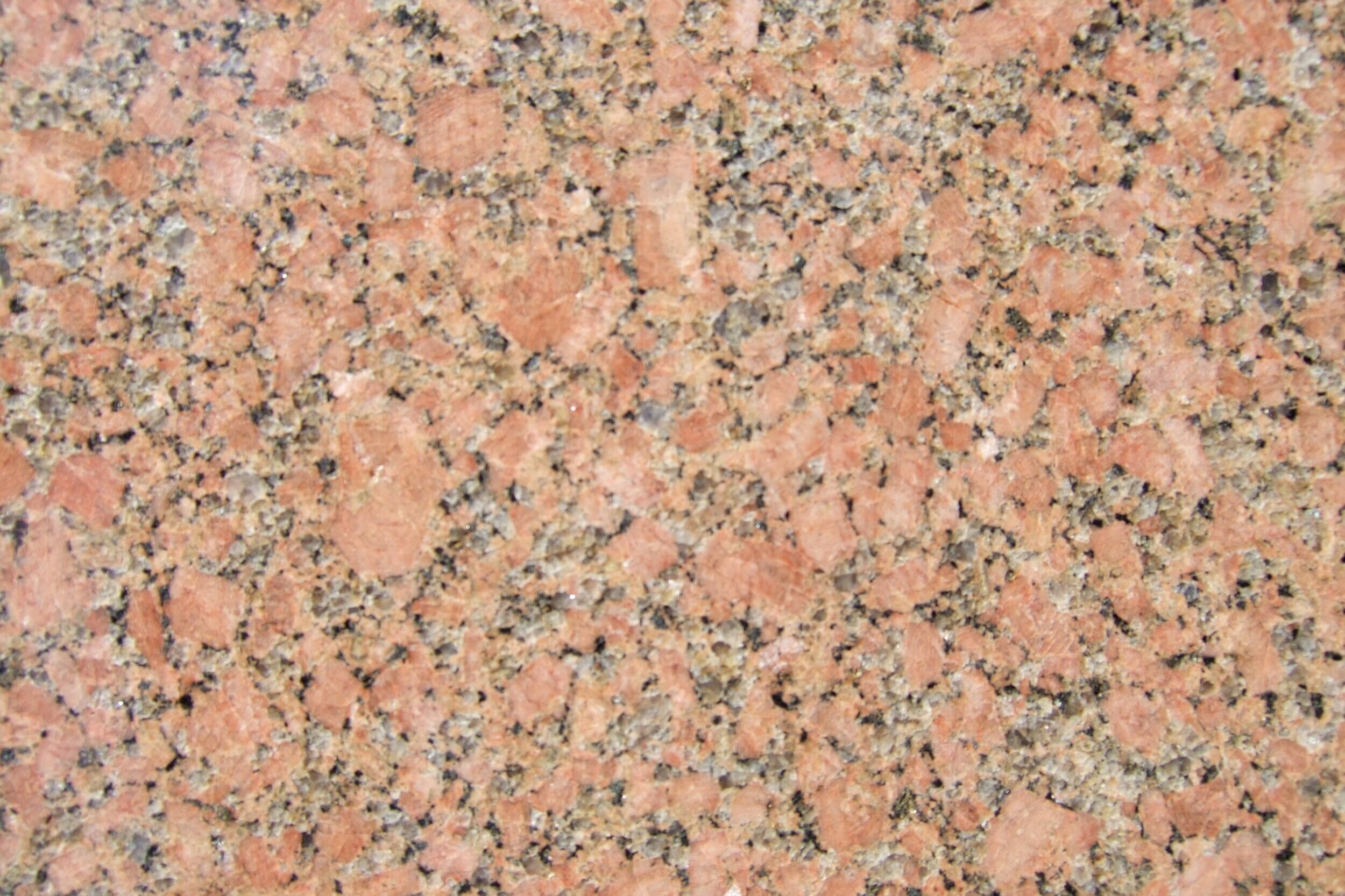 In contrast, here’s some granite. Like basalt, it cooled from molten rock. However, it cooled underground much more slowly. Because of this, you can actually see the minerals that make up the rock with the naked eye!